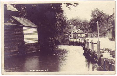 005 - Ford over the River
Robert H Clark's series posted in Buntingford and dated 26th July 1906 showing the river that caused Layston church it's access problems in the past, along with the bridge that crosses it and the brick building known as the Cage.
