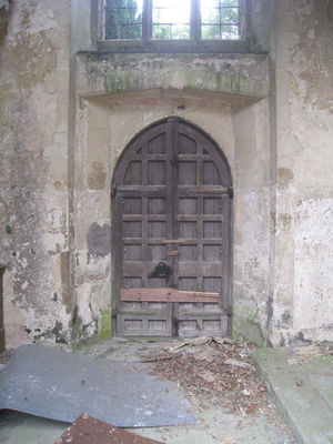 06 - West door from the base of the Tower
This door is the one with the crime attached to it. It's all intact but had a sheet of steel bolted to it with 10mm bolt's - about 20 of them :-(
